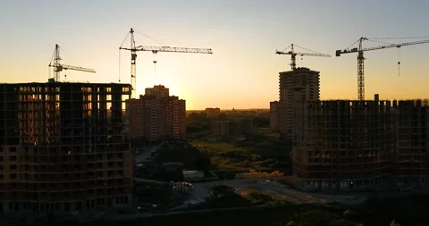 Aerial drone view of construction of a new residential complex at sunset 스톡 동영상 169409415