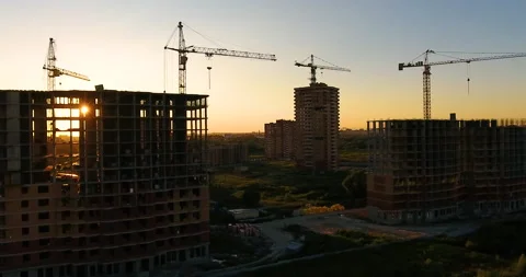 Aerial drone view of construction of a new residential complex at sunset 스톡 동영상 169409716