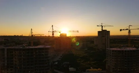 Aerial drone view of construction of a new residential complex at sunset 스톡 동영상 169410543