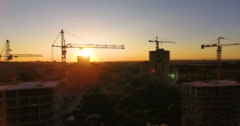 Aerial drone view of construction of a new residential complex at sunset 스톡 동영상 169411003