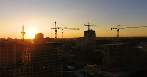 Aerial drone view of construction of a new residential complex at sunset 스톡 동영상 169411277