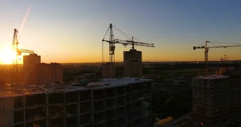 Aerial drone view of construction of a new residential complex at sunset 스톡 동영상 169411787