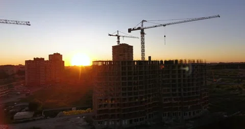 Aerial drone view of construction of a new residential complex at sunset 스톡 동영상 169412987