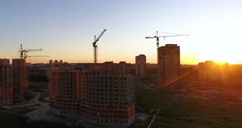 Aerial drone view of construction of a new residential complex at sunset 스톡 동영상 169413568