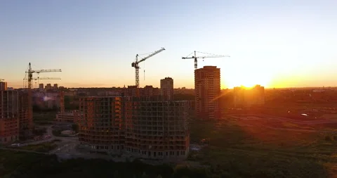 Aerial drone view of construction of a new residential complex at sunset 스톡 동영상 169413829
