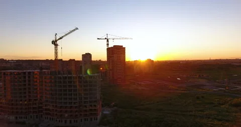 Aerial drone view of construction of a new residential complex at sunset 스톡 동영상 169414573