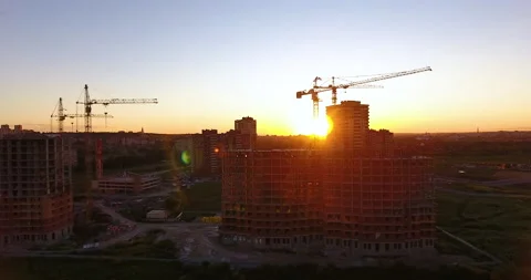 Aerial drone view of construction of a new residential complex at sunset 스톡 동영상 169414646
