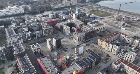 Aerial drone view of the construction of new and modern residential housing at Stock Footage 256249977