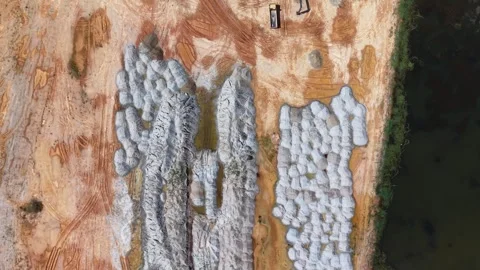 Aerial drone view of construction site stockpiles and equipment Видео 329355936