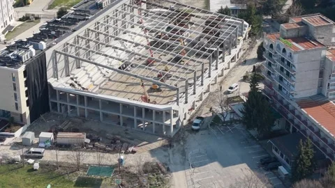 Aerial drone view of construction site with building framework in city Vídeo Stock 331505887