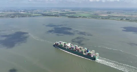 Aerial drone view of a container ship at sea, focusing on the container 스톡 동영상 250786461