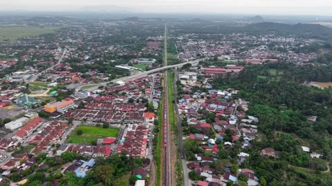 Aerial drone view of container train moving through Bukit Mertajam Stock Footage 333049178