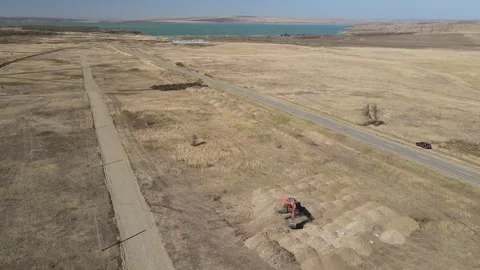 Aerial drone view of a crawler excavator digging on a construction site Stock Footage 337479515