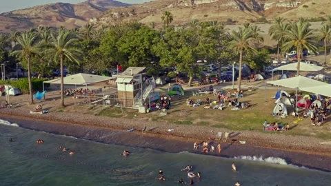 Aerial drone view of a crowded beach of Kineret, Tiberias, Israel, 4k Stock Footage 134970545
