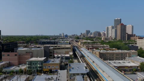 Aerial drone view of a CTA train station and elevated tracks in Chicago, with Stock Footage 346384646