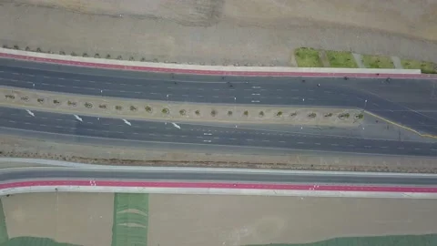 Aerial drone view of cyclists riding on the Costa Verde fast track in San Miguel Stock-Footage 142148307