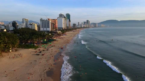 Aerial drone view of Da Nang beach skyline and tropical coastline at sunset Stock Footage 340536469