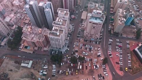 Aerial Drone View of Dense Urban Buildings and Crowded Parking Lots in Kuwait Stock Footage 325830634