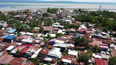 Aerial drone view of dense urban neighborhood and bridge in Davao Philippine Stock-Footage 337512967