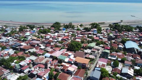 Aerial drone view of dense urban neighborhood and bridge in Davao Philippine Stock Footage 337512969