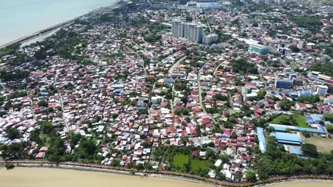 Aerial drone view of dense urban neighborhood and bridge in Davao Philippine Stock Footage 337513396