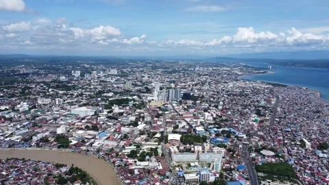 Aerial drone view of dense urban neighborhood and bridge in Davao Philippine Stock Footage 337513467
