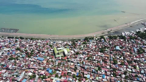 Aerial drone view of dense urban neighborhood and bridge in Davao Philippine Video stock 337513511