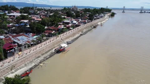 Aerial drone view of dense urban neighborhood and bridge in Davao Philippine Stock Footage 337513847