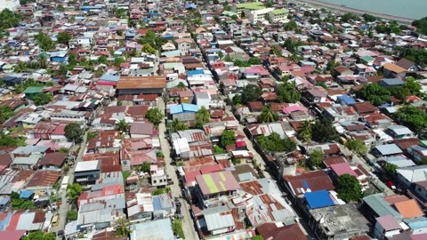 Aerial drone view of dense urban neighborhood and bridge in Davao Philippine Stock Footage 337513877
