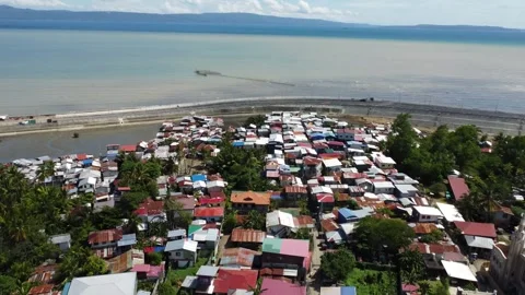 Aerial drone view of dense urban neighborhood and bridge in Davao Philippine Stock Footage 337513890
