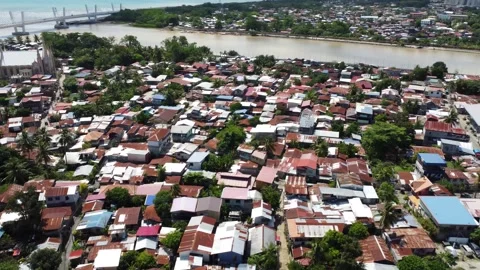Aerial drone view of dense urban neighborhood and bridge in Davao Philippine Video stock 337513892
