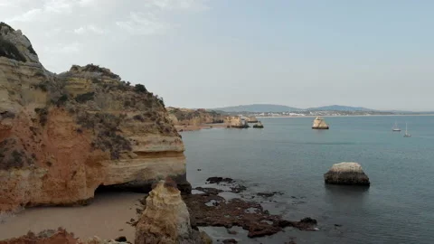 Aerial drone view of the deserted empty rocky beach and cliffs in Portugal. Stock Footage 140536362