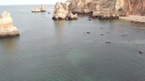 Aerial drone view of the deserted empty rocky beach and cliffs in Portugal. Stock Footage 140536712