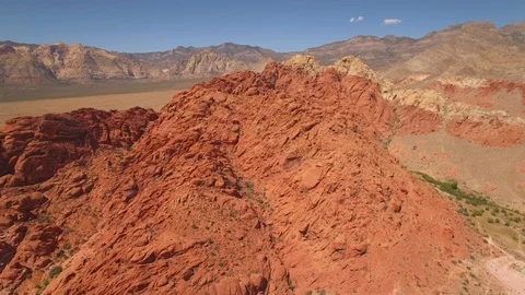 Aerial Drone view of desertic red rock mountain ridge and canyon near Las Vegas Video stock 100859711
