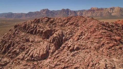 Aerial Drone view of desertic red rock mountain ridge and canyon near Las Vegas Video stock 100859757