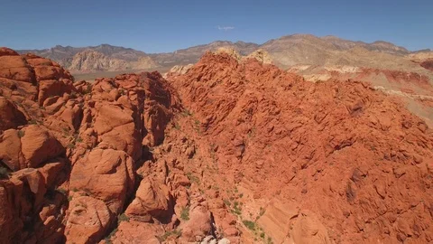 Aerial Drone view of desertic red rock mountain ridge and canyon near Las Vegas Video stock 100859856