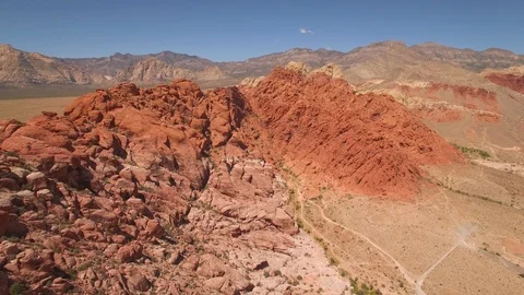 Aerial Drone view of desertic red rock mountain ridge and canyon near Las Vegas Video stock 100859885