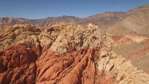 Aerial Drone view of desertic red rock mountain ridge and canyon near Las Vegas Video stock 100859979