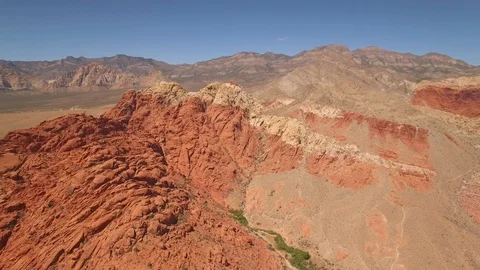 Aerial Drone view of desertic red rock mountain ridge and canyon near Las Vegas Video stock 100859989