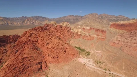 Aerial Drone view of desertic red rock mountain ridge and canyon near Las Vegas Video stock 100860026