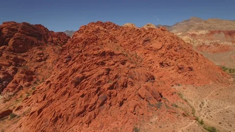 Aerial Drone view of desertic red rock mountain ridge and canyon near Las Vegas Stock Footage 100860101