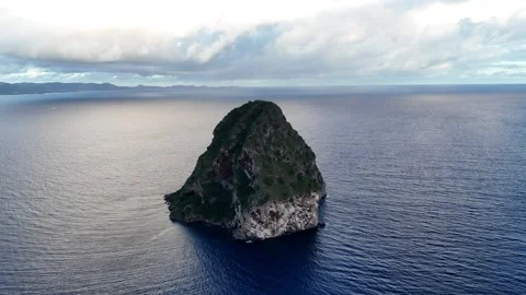 Aerial drone view of Diamond Rock, Martinique - iconic island in turquoise sea Stock Footage 306954005