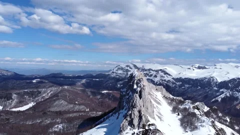 Aerial drone view of difficult access mountain peak for climbers during winter Stock Footage 171816631