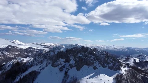 Aerial drone view of difficult access mountain peak for climbers during winter Video stock 172022158