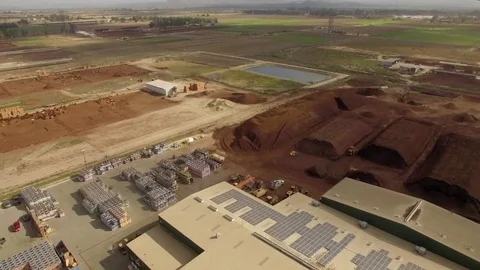 Aerial drone view of dirt soil fertilizer treatment plan facility Stock Footage 84141865