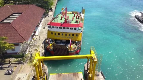 Aerial drone view of docking ferry. Ferry transports cars, motorcycles, people 動画素材 220601562