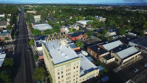 Aerial drone view of downtown Bozeman Montana hotel in Summer Stock Footage