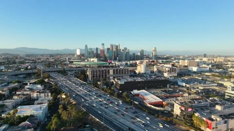 Aerial Drone View of Downtown Los Angeles Skyline and Freeway Traffic Видео 340656636
