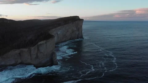 Aerial drone view of dramatic Cap Gaspé cliffs at dusk, Forillon National Park Stock Footage 330950819
