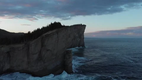 Aerial drone view of dramatic Cap Gaspé cliffs at dusk, Forillon National Park Stock Footage 330950821